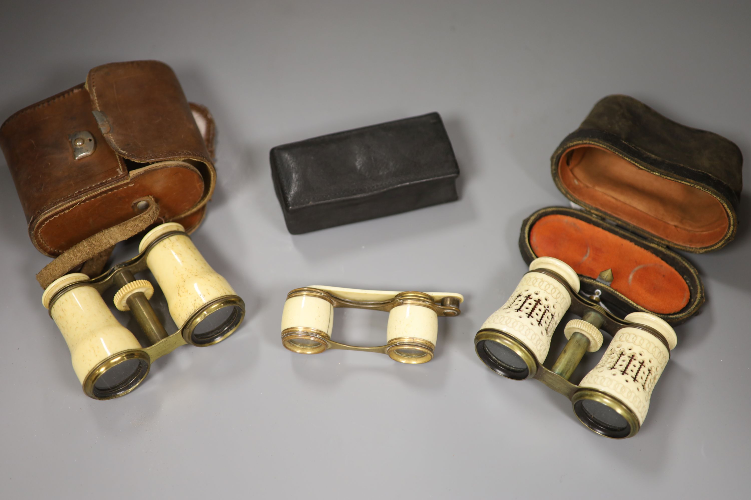 Three pairs bone opera glasses